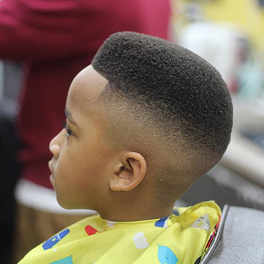 african american school kid with a mohawk style haircut
