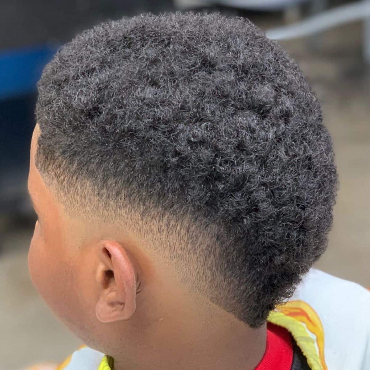 african american school kid with a mohawk style haircut